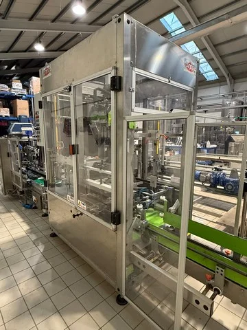 Used Oma case erector and case packer